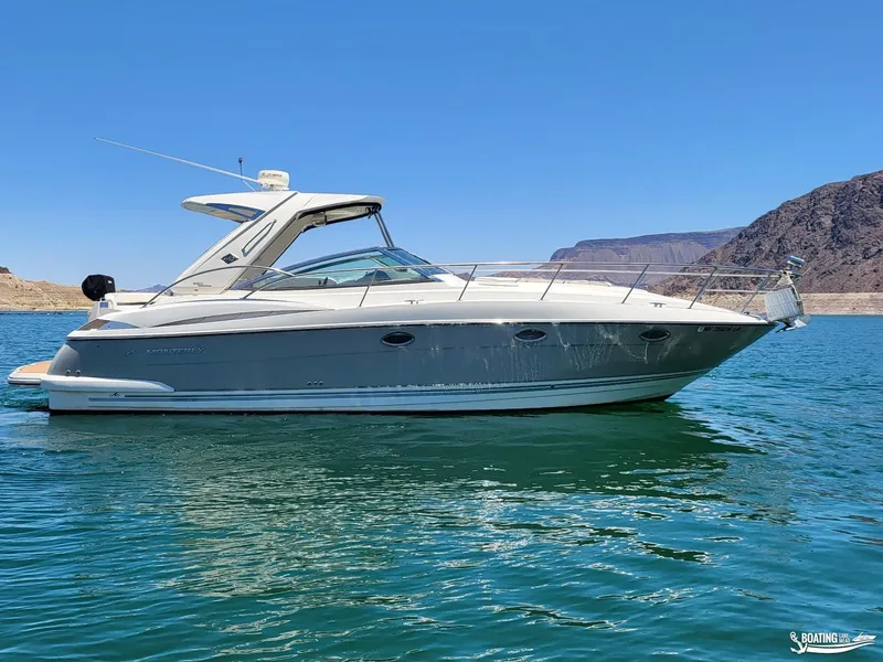 Slide: The Image of 2008 Monterey 350 Sport Yacht on clear blue water with mountainous background. - 6