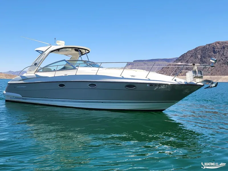 Slide: The Image of 2008 Monterey 350Sport Yacht on clear blue water with mountainous background. - 8
