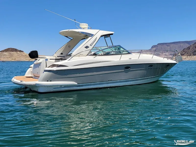 Slide: The Image of 2008 Monterey 350Sport Yacht on clear blue water with scenic mountain backdrop. - 9