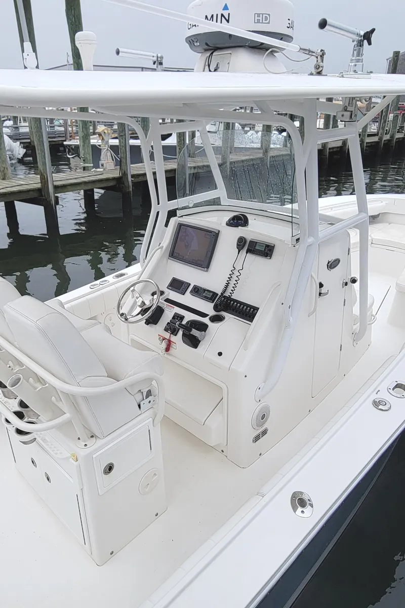 Slide: The Image of 2014 Regulator 28 Forward Seating boat console with advanced navigation equipment. - 3