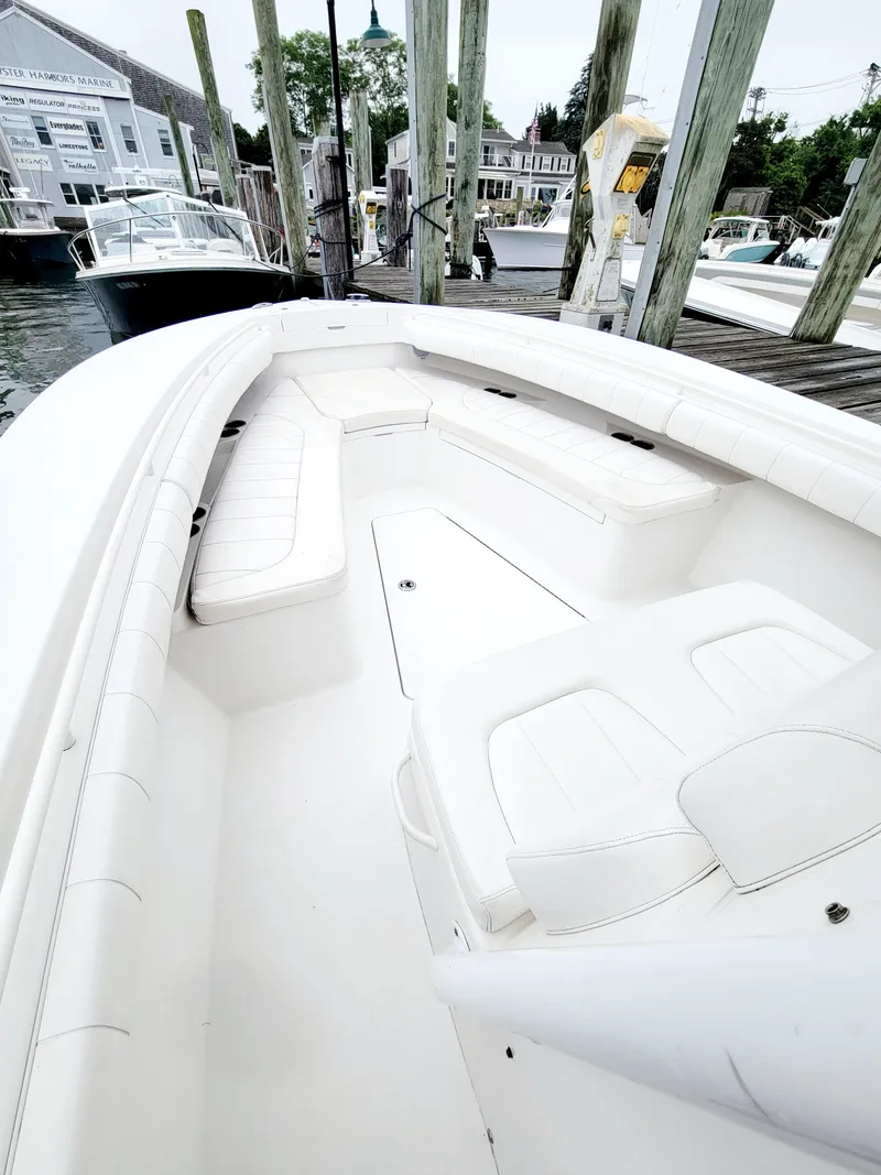 Slide: The Image of 2014 Regulator 28 Forward Seating boat docked at a marina. - 9