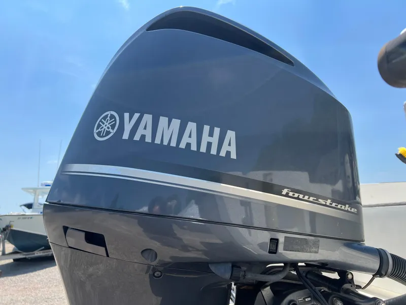 Slide: The Image of Close-up of Yamaha four-stroke outboard motor on 1985 Mako 258 Cuddy boat. - 15