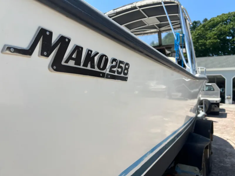Slide: The Image of 1985 Mako 258 Cuddy boat on trailer, side view. - 17