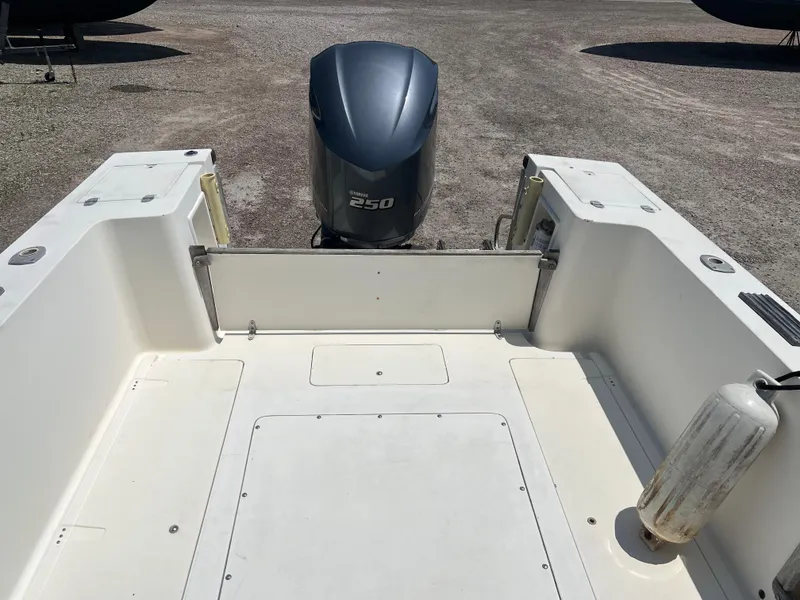 Slide: The Image of 1985 Mako 258 Cuddy boat stern with Yamaha 250 outboard motor. - 20