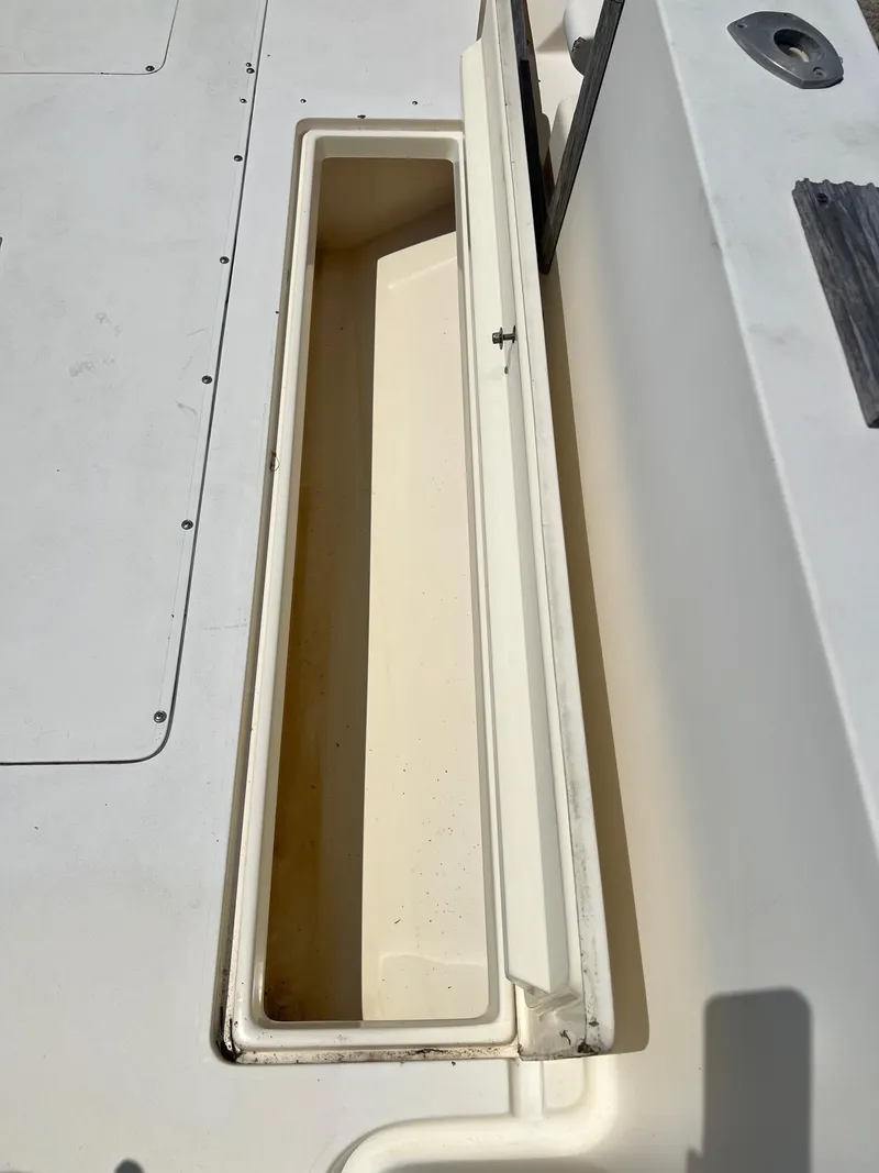 Slide: The Image of 1985 Mako 258 Cuddy boat storage compartment. - 29