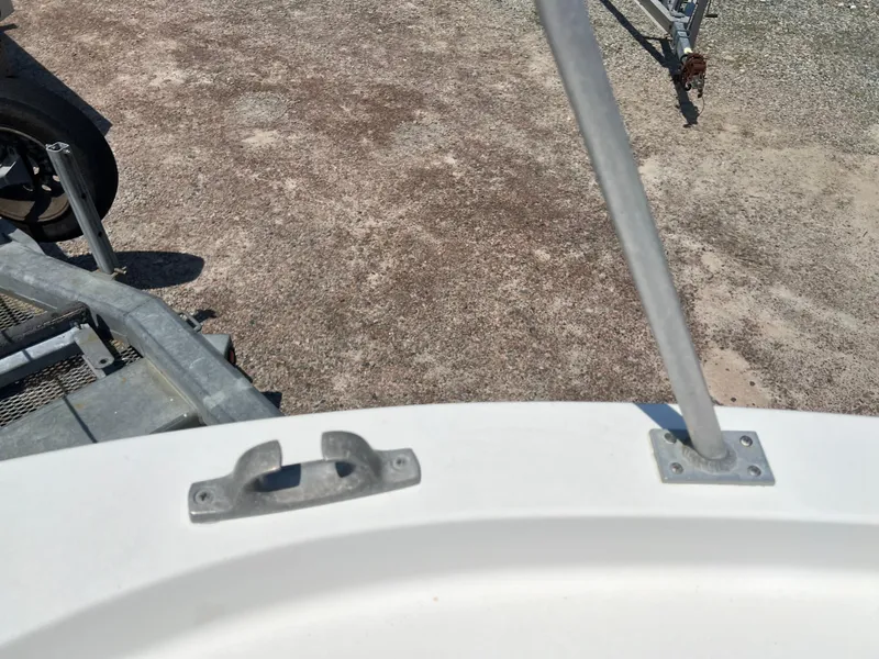 Slide: The Image of 1985 Mako 258 Cuddy boat bow with cleat and railing. - 31