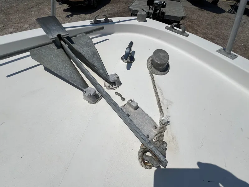 Slide: The Image of 1985 Mako 258 Cuddy boat anchor and rope setup. - 34