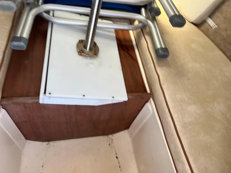 Slide: The Image of Interior of 1985 Mako 258 Cuddy with seating and storage area. - 39