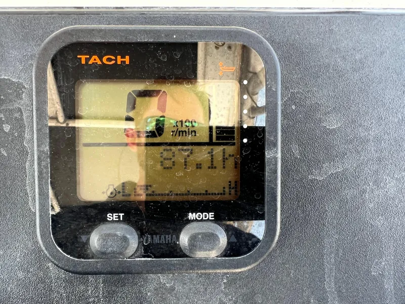 Slide: The Image of Tachometer display on a 1985 Mako 258 Cuddy boat showing 871 hours. - 46