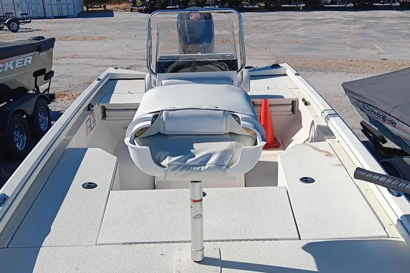 Slide: The Image of 2024 Ranger RB190 boat interior with seating and console, parked on a trailer. - 3
