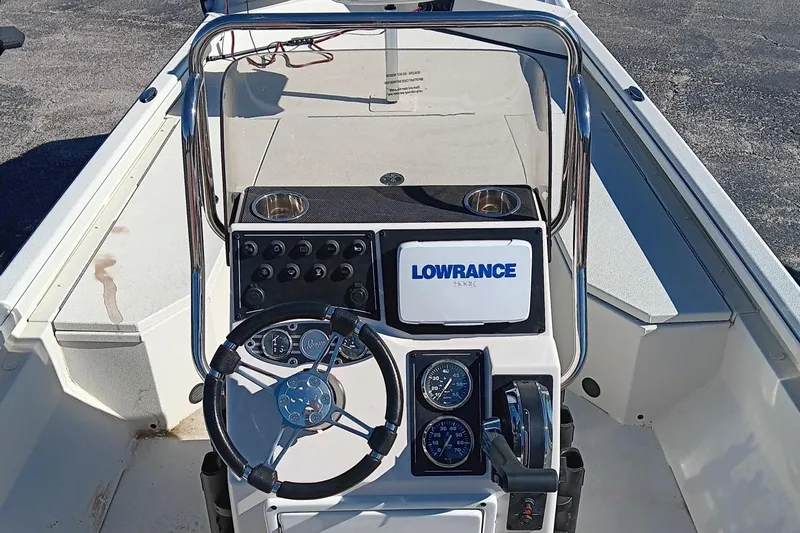 Slide: The Image of 2024 Ranger RB190 boat dashboard with Lowrance electronics and steering wheel. - 4