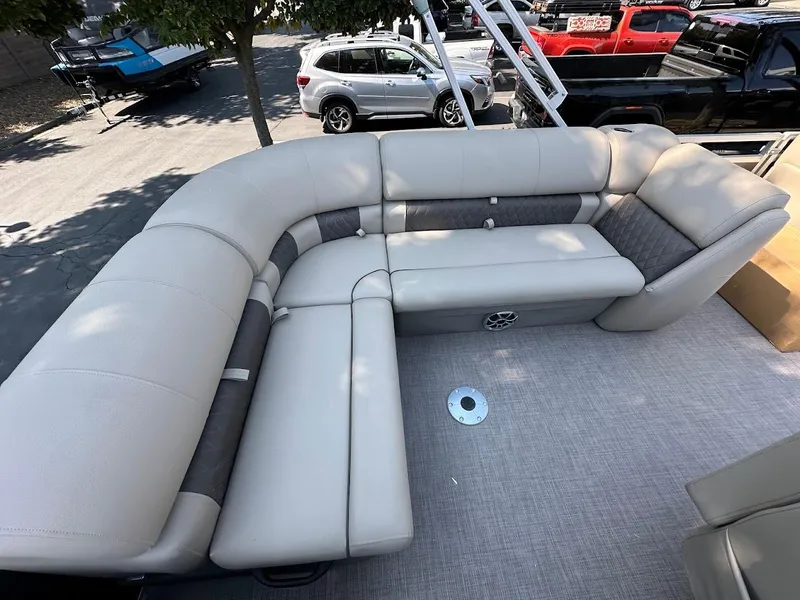 Slide: The Image of 2024 Sun Tracker Party Barge 20 DLX interior with spacious seating and modern design. - 16