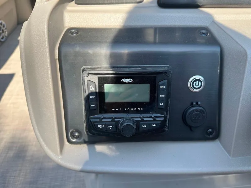 Slide: The Image of 2024 Sun Tracker Party Barge 20 DLX audio control panel with Wet Sounds system. - 19
