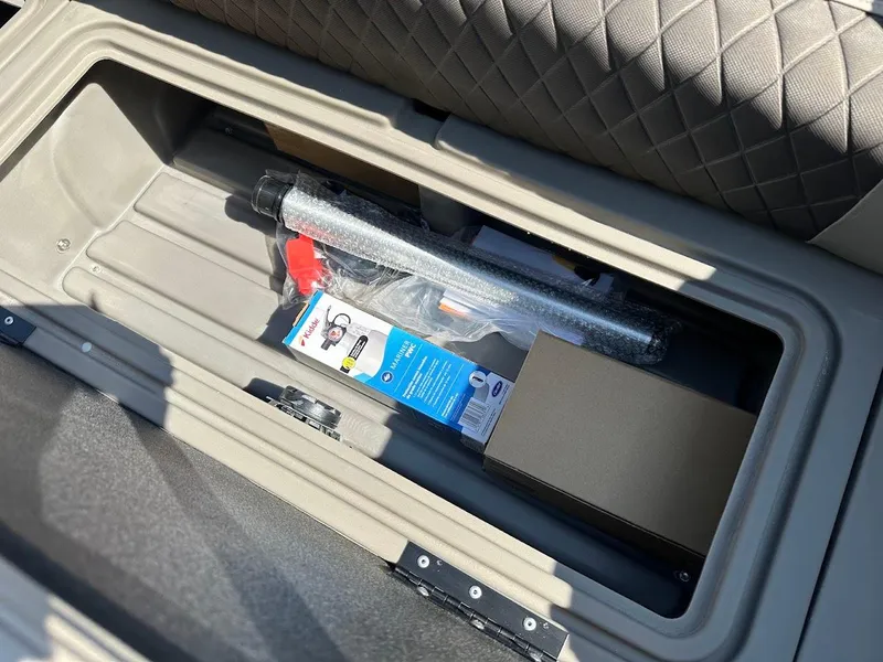 Slide: The Image of Storage compartment in 2024 Sun Tracker Party Barge 20 DLX with accessories. - 25