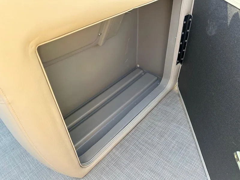 Slide: The Image of 2024 Sun Tracker Party Barge 20 DLX storage compartment interior. - 30