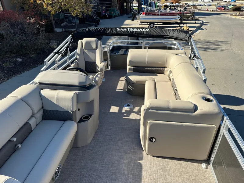 Slide: The Image of 2024 Sun Tracker Fishin' Barge 20 DLX pontoon boat with spacious seating and modern design. - 5