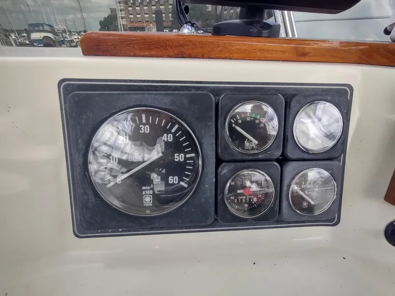 Slide: The Image of Instrument panel of a 1988 Tollycraft 34 Sport Sedan boat. - 32