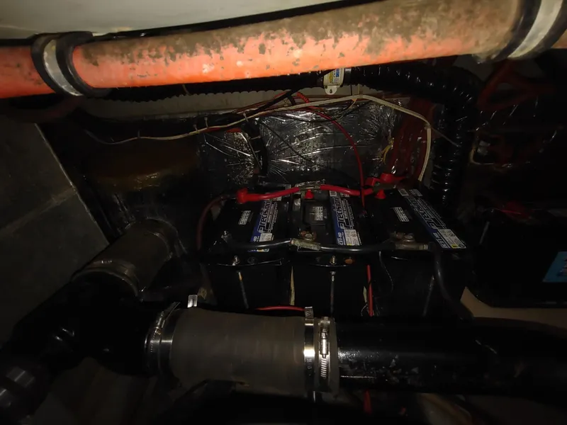 Slide: The Image of Engine compartment of a 1988 Tollycraft 34 Sport Sedan with batteries and wiring. - 40
