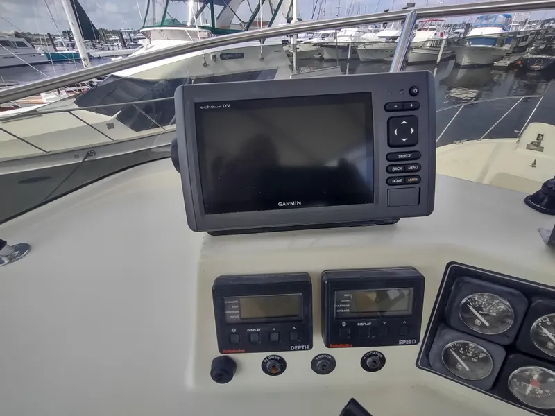 Slide: The Image of 1988 Tollycraft 34 Sport Sedan helm with Garmin GPS and depth/speed gauges. - 31