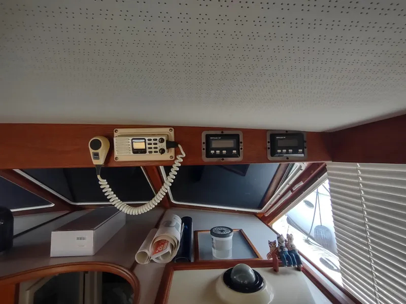 Slide: The Image of Interior of 1988 Tollycraft 34 Sport Sedan with navigation equipment and controls. - 24