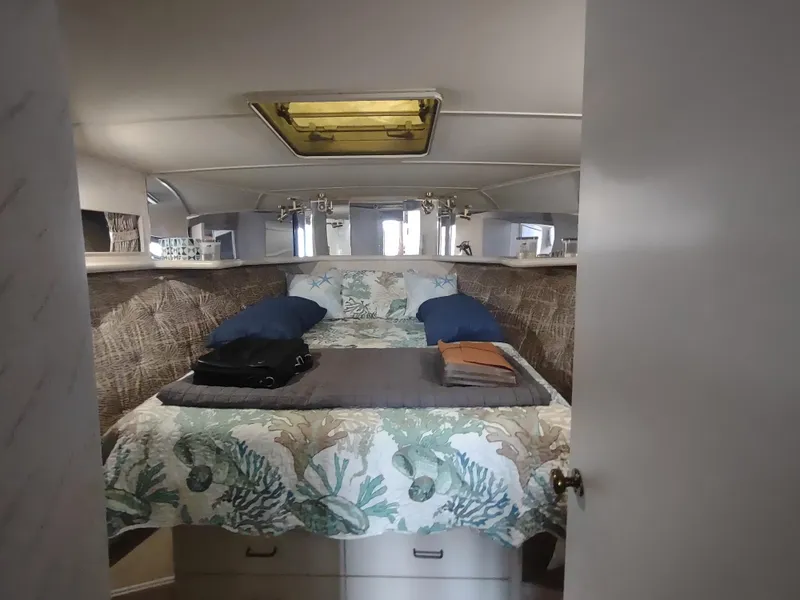 Slide: The Image of 1988 Tollycraft 34 Sport Sedan cabin with bed and skylight. - 14