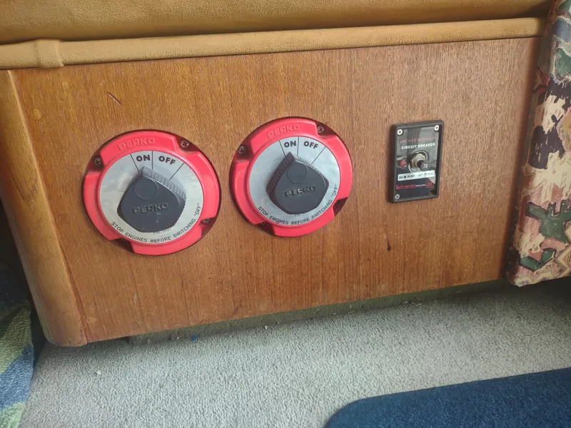 Slide: The Image of 1988 Tollycraft 34 Sport Sedan battery switches and control panel. - 25