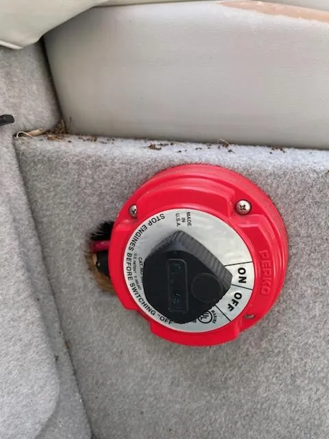 Slide: The Image of Red battery switch on a 2007 Bayliner Discovery 215 boat. - 11