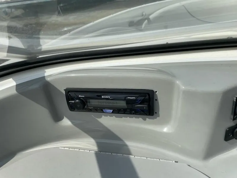Slide: The Image of 2007 Bayliner Discovery 215 boat dashboard with Sony stereo system. - 4