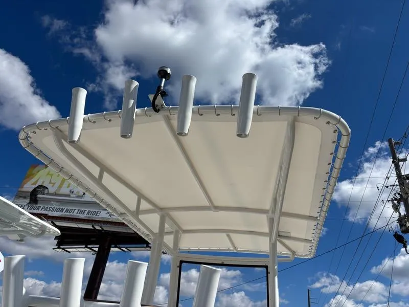 Slide: The Image of Polar 220 boat canopy against a blue sky with clouds, 2024 model. - 5