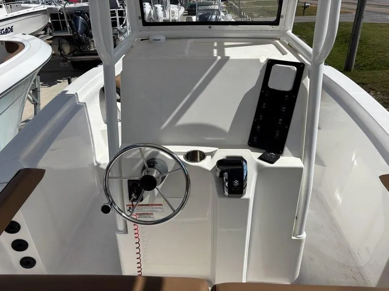 Slide: The Image of 2024 Polar 220 boat console with steering wheel and control panel. - 8