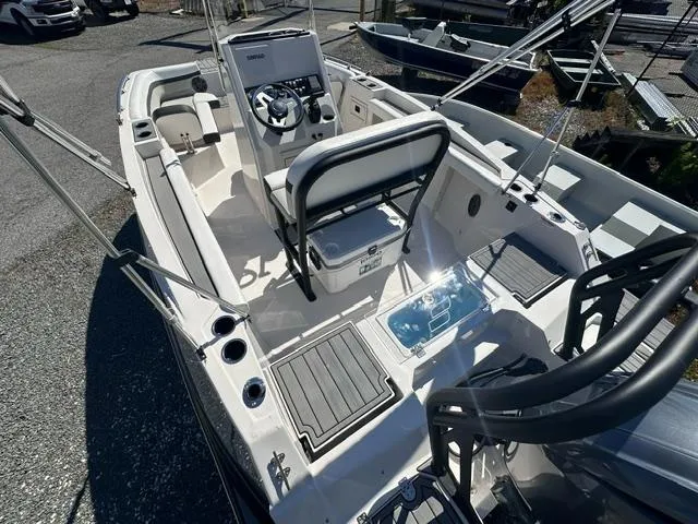 Slide: The Image of 2025 Starcraft SVX 191 OB CC boat interior with steering console and seating. - 4