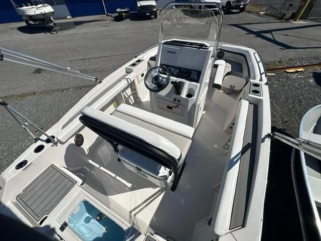 Slide: The Image of 2025 Starcraft SVX 191 OB CC boat interior with center console and seating. - 5