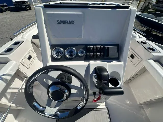 Slide: The Image of Steering console of 2025 Starcraft SVX 191 OB CC boat with Simrad electronics. - 6