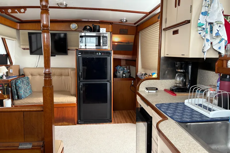 Slide: The Image of Interior of a 1982 Monk 40 boat with kitchen and seating area. - 32
