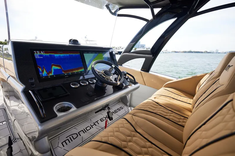 Slide: The Image of 2024 Midnight Express 37' Open boat interior with advanced navigation system and luxurious seating. - 18