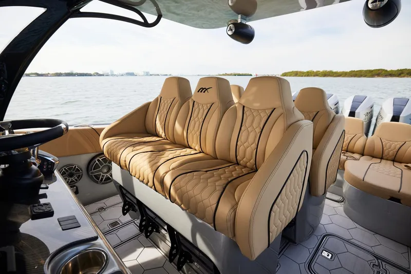 Slide: The Image of Luxurious seating on the 2024 Midnight Express 37' Open boat with scenic water view. - 19