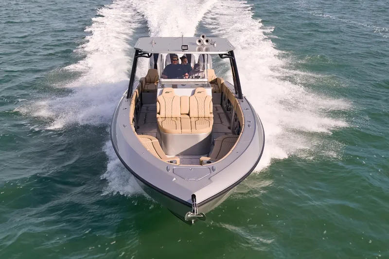 Slide: The Image of 2024 Midnight Express 37' Open boat cruising on water. - 2