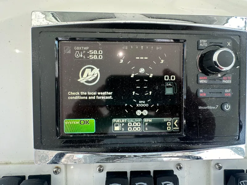 Slide: The Image of 2014 Albemarle 360 Express Fisherman dashboard with VesselView7 display showing system status. - 16