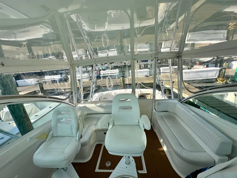 Slide: The Image of 2014 Albemarle 360 Express Fisherman interior with white seating and marina view. - 21