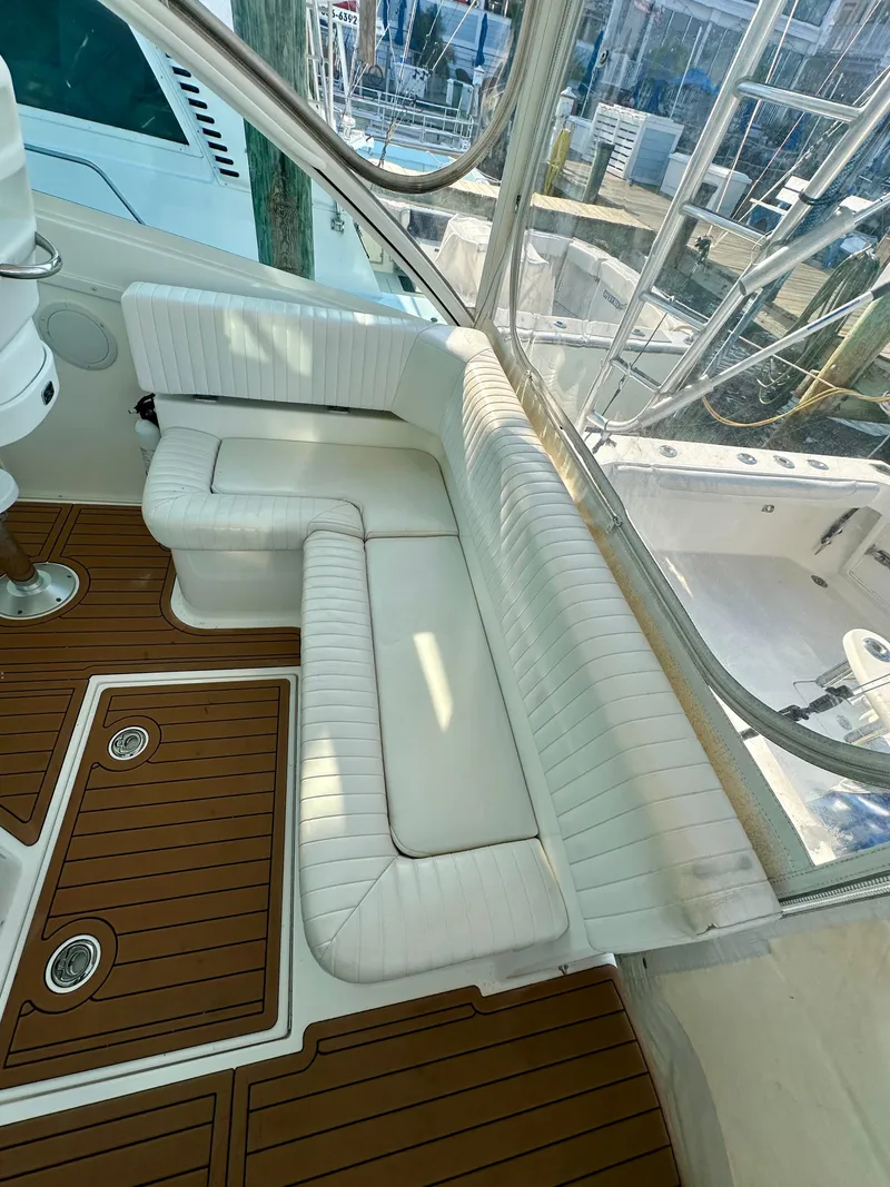 Slide: The Image of 2014 Albemarle 360 Express Fisherman interior with white seating and teak flooring. - 23