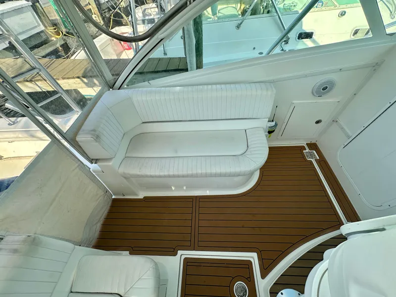 Slide: The Image of 2014 Albemarle 360 Express Fisherman interior with white seating and wooden flooring. - 24