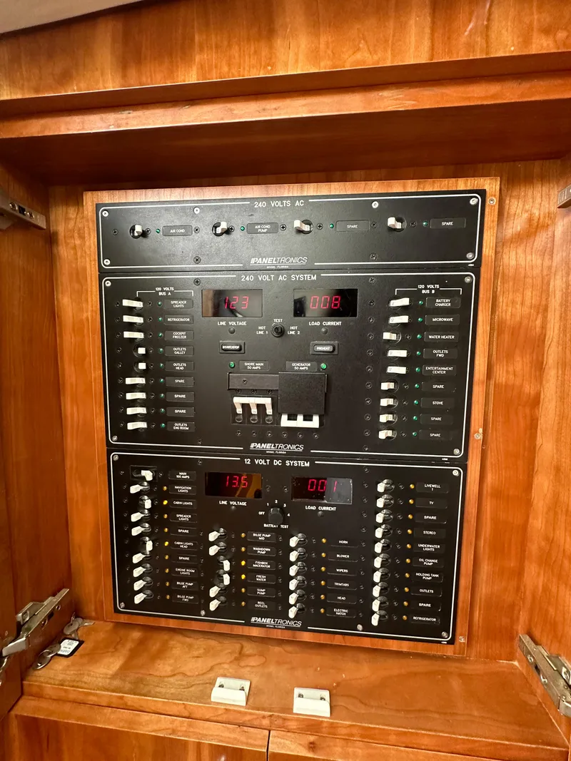 Slide: The Image of Electrical panel on 2014 Albemarle 360 Express Fisherman boat, featuring AC and DC systems. - 27