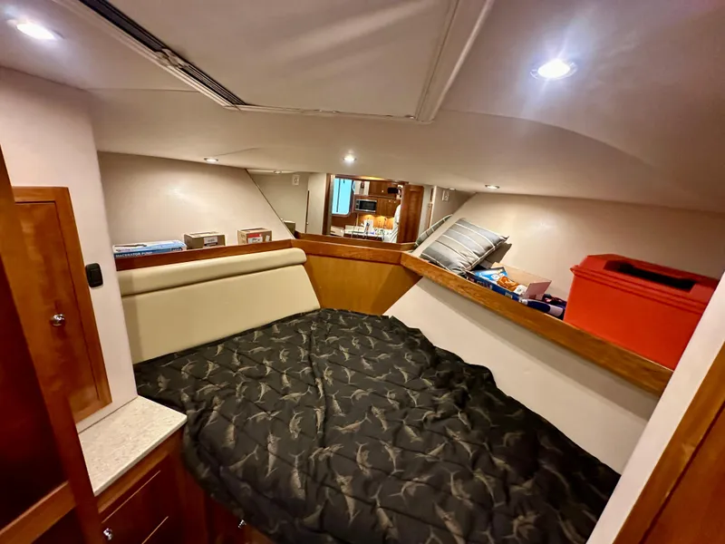 Slide: The Image of Cozy cabin interior of 2014 Albemarle 360 Express Fisherman with bed and storage. - 35