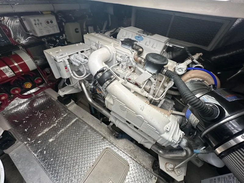 Slide: The Image of Engine compartment of a 2014 Albemarle 360 Express Fisherman boat, showcasing detailed machinery. - 38