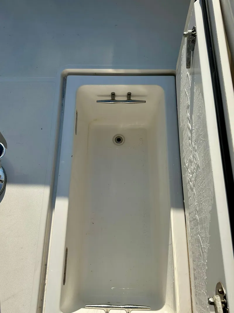 Slide: The Image of Open storage compartment on 2014 Albemarle 360 Express Fisherman boat deck. - 4