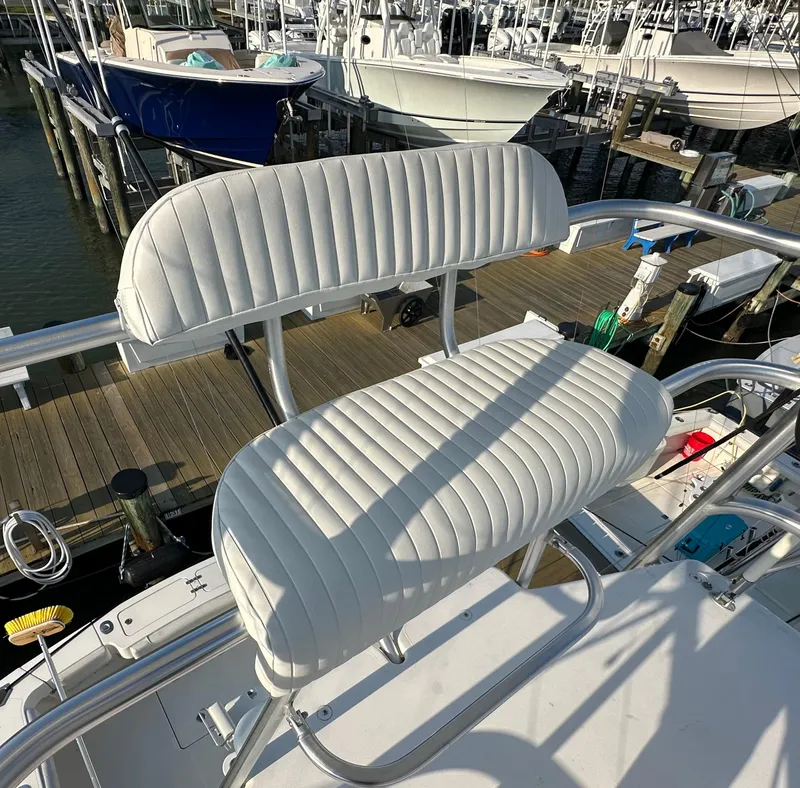 Slide: The Image of 2014 Albemarle 360 Express Fisherman boat with white cushioned seating at the dock. - 46