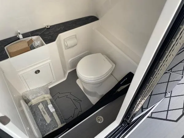 Slide: The Image of 2025 Fountain 32 NX boat dashboard with modern controls and navigation screens. - 15