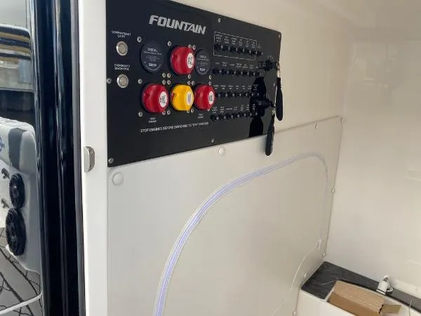 Slide: The Image of 2025 Fountain 32 NX boat bathroom with toilet and storage. - 17