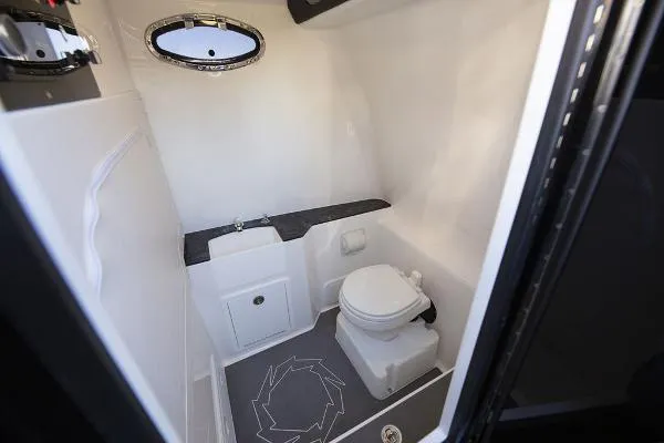 Slide: The Image of 2025 Fountain 32 NX boat docked with twin outboard engines. - 5