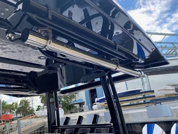 Slide: The Image of 2025 Fountain 32 NX boat interior with dual seats and twin outboard engines. - 8